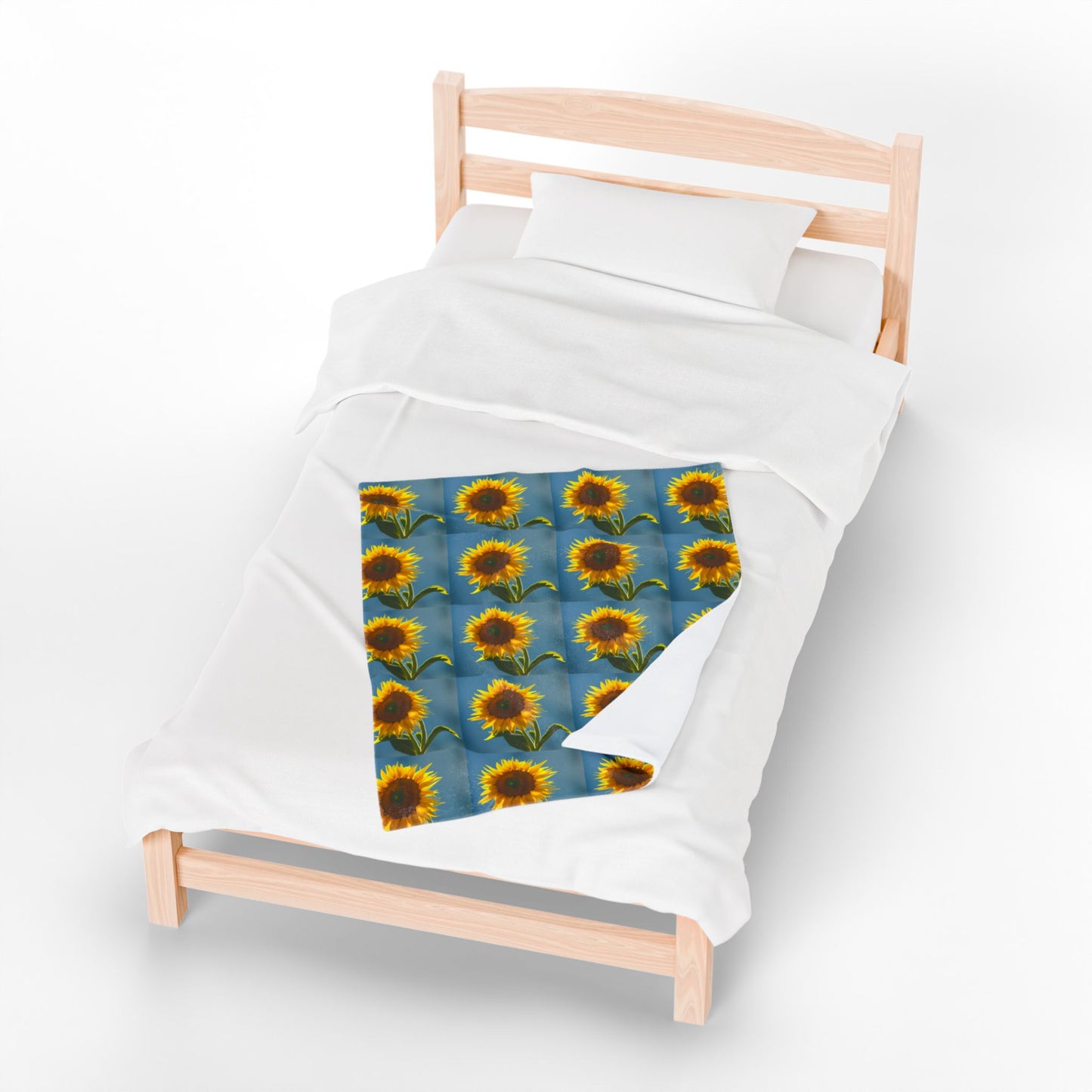 Bring a burst of sunshine into your space with this vibrant sunflower-themed throw blanket! Featuring bold, blooming sunflowers on a calming blue background, this cozy blanket adds warmth and cheerful charm to any bedroom, kid’s room, or living space. Perfect for snuggling on chilly nights or adding a pop of floral style to your home decor.