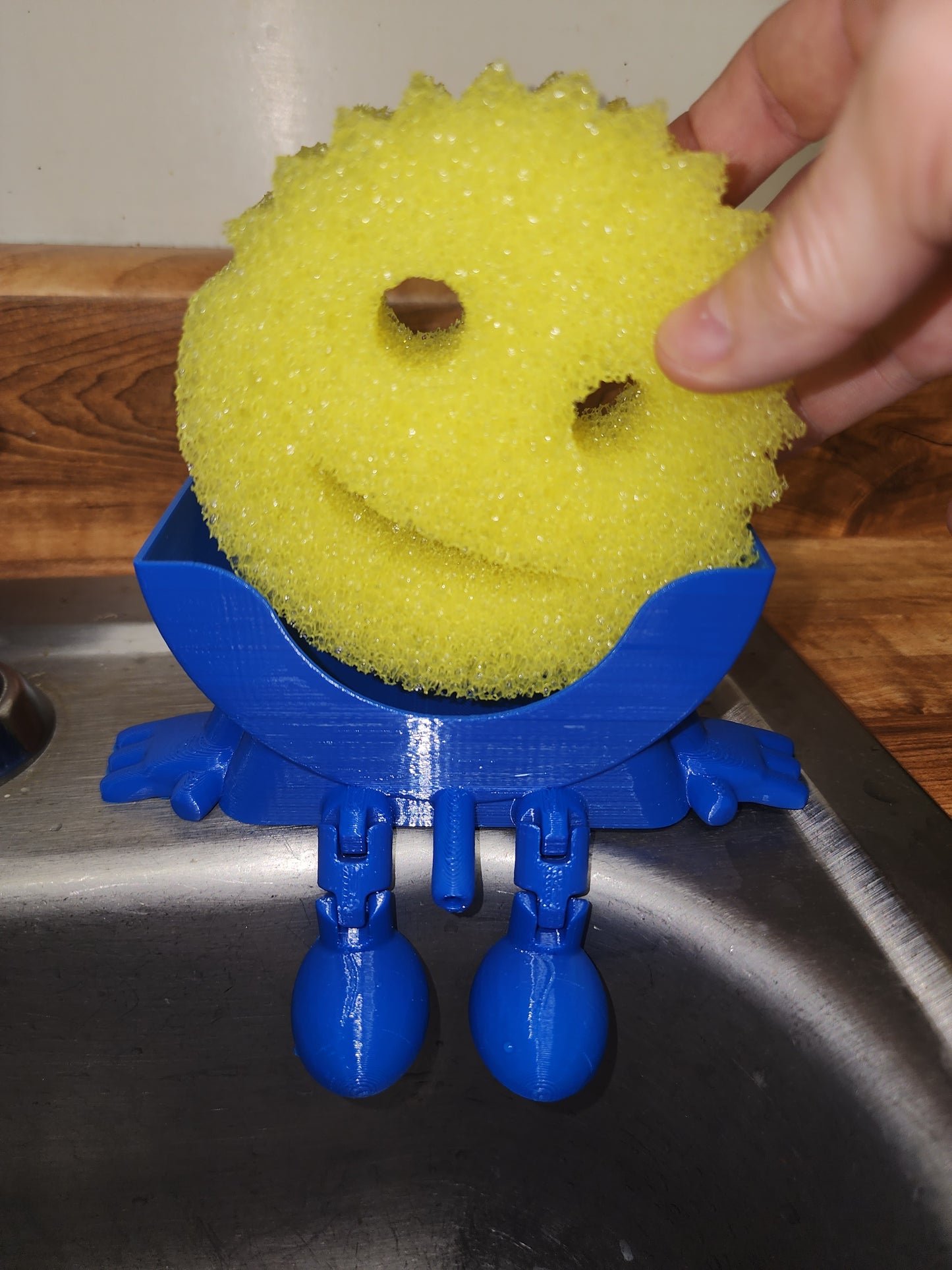 Meet Mr. Dripper, the tidy little helper your sink has been waiting for. Designed specifically to hold your Scrub Daddy, this clever sponge holder keeps your sponge upright, dry, and always within reach.

No more soggy sponges or cluttered sink edges, Mr. Dripper allows proper airflow so your Scrub Daddy dries faster and stays fresher between uses. Its compact, sink-friendly design fits perfectly near the faucet, making daily cleanup easier and more organized.