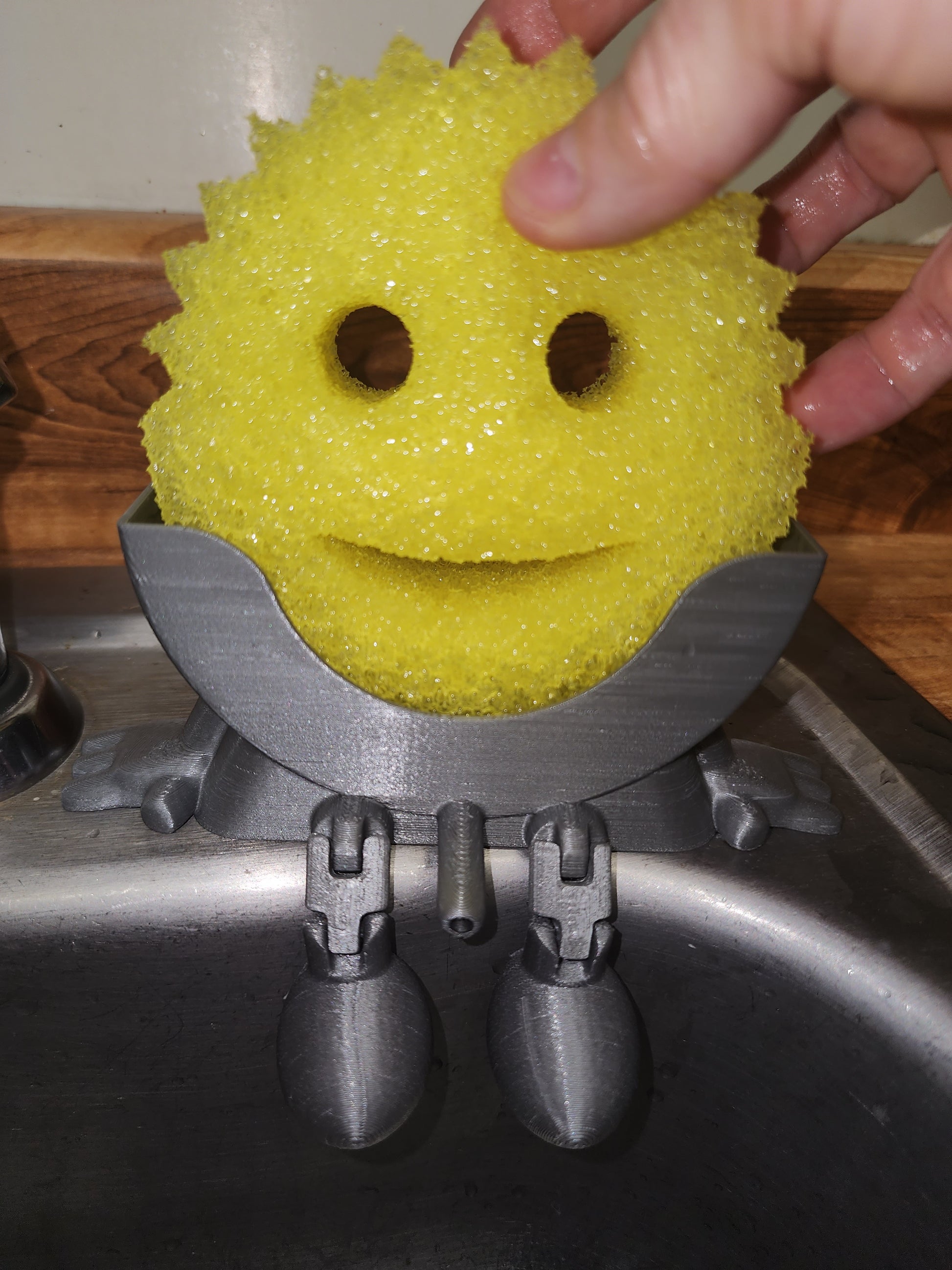 Meet Mr. Dripper, the tidy little helper your sink has been waiting for. Designed specifically to hold your Scrub Daddy, this clever sponge holder keeps your sponge upright, dry, and always within reach.

No more soggy sponges or cluttered sink edges, Mr. Dripper allows proper airflow so your Scrub Daddy dries faster and stays fresher between uses. Its compact, sink-friendly design fits perfectly near the faucet, making daily cleanup easier and more organized.