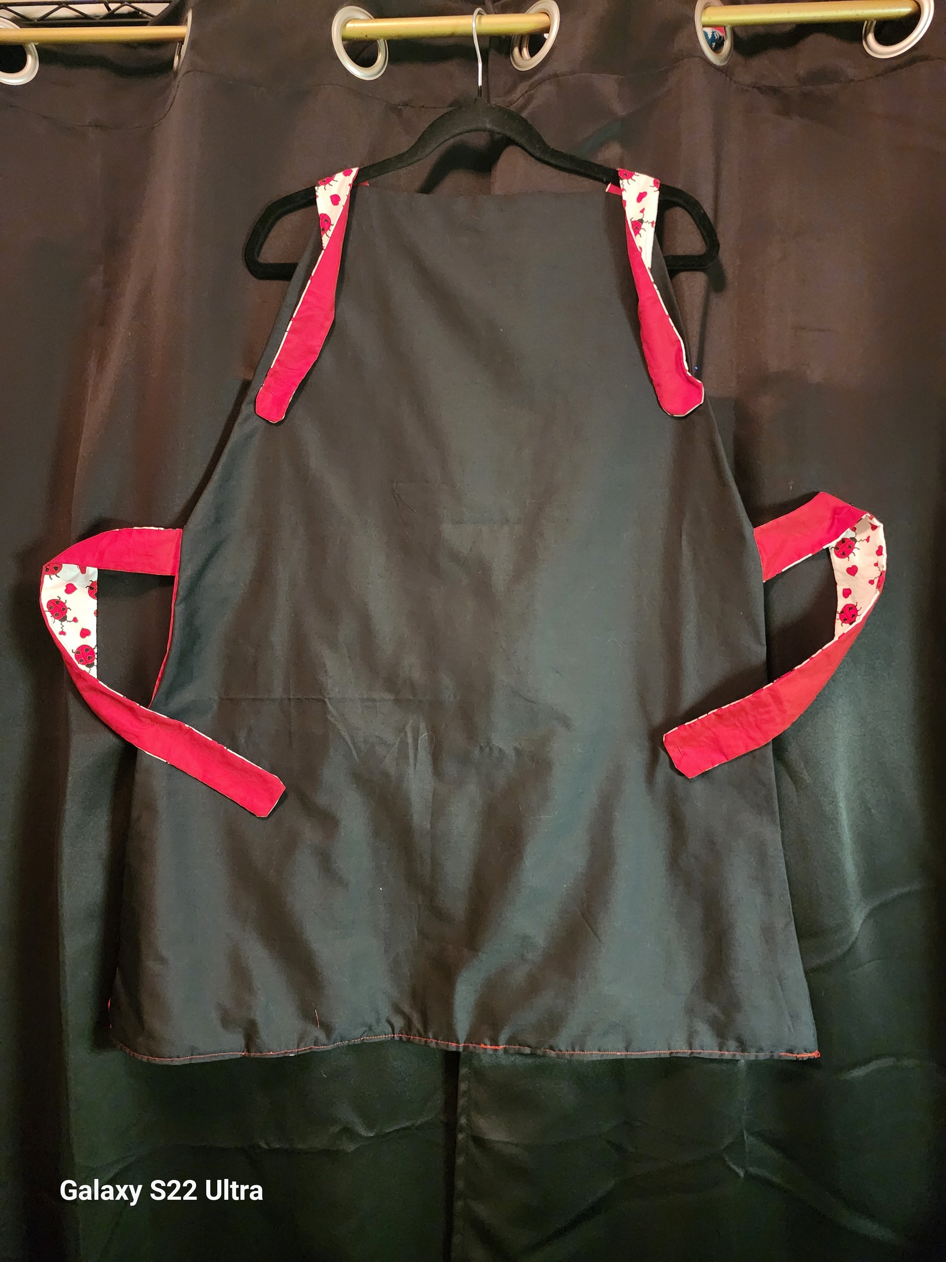 Celebrate love in the kitchen with our charming Love Bug adult apron! Handmade with care, this apron features a rich red base accented by an adorable ladybug-and-heart print that brings playful Valentine vibes to any bake day or dinner prep.