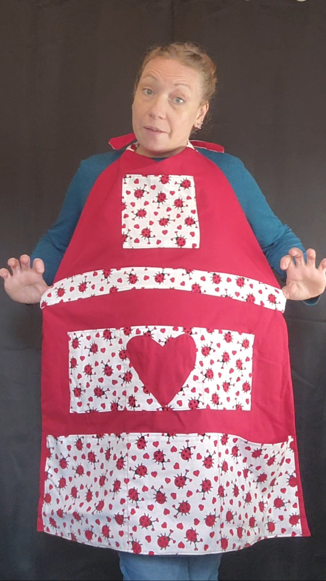 Celebrate this Valentine's Day with love in the kitchen in our charming Love Bug adult apron! Handmade with care, this apron features 7 pockets with a rich red base accented by an adorable ladybug-and-heart print that brings playful Valentine vibes to any bake day or dinner prep.