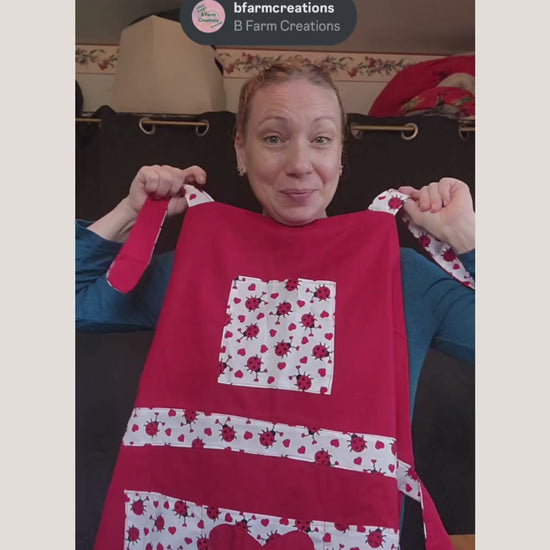 Celebrate love in the kitchen with our charming Love Bug adult apron! Handmade with care, this apron features a rich red base accented by an adorable ladybug-and-heart print that brings playful Valentine vibes to any bake day or dinner prep.