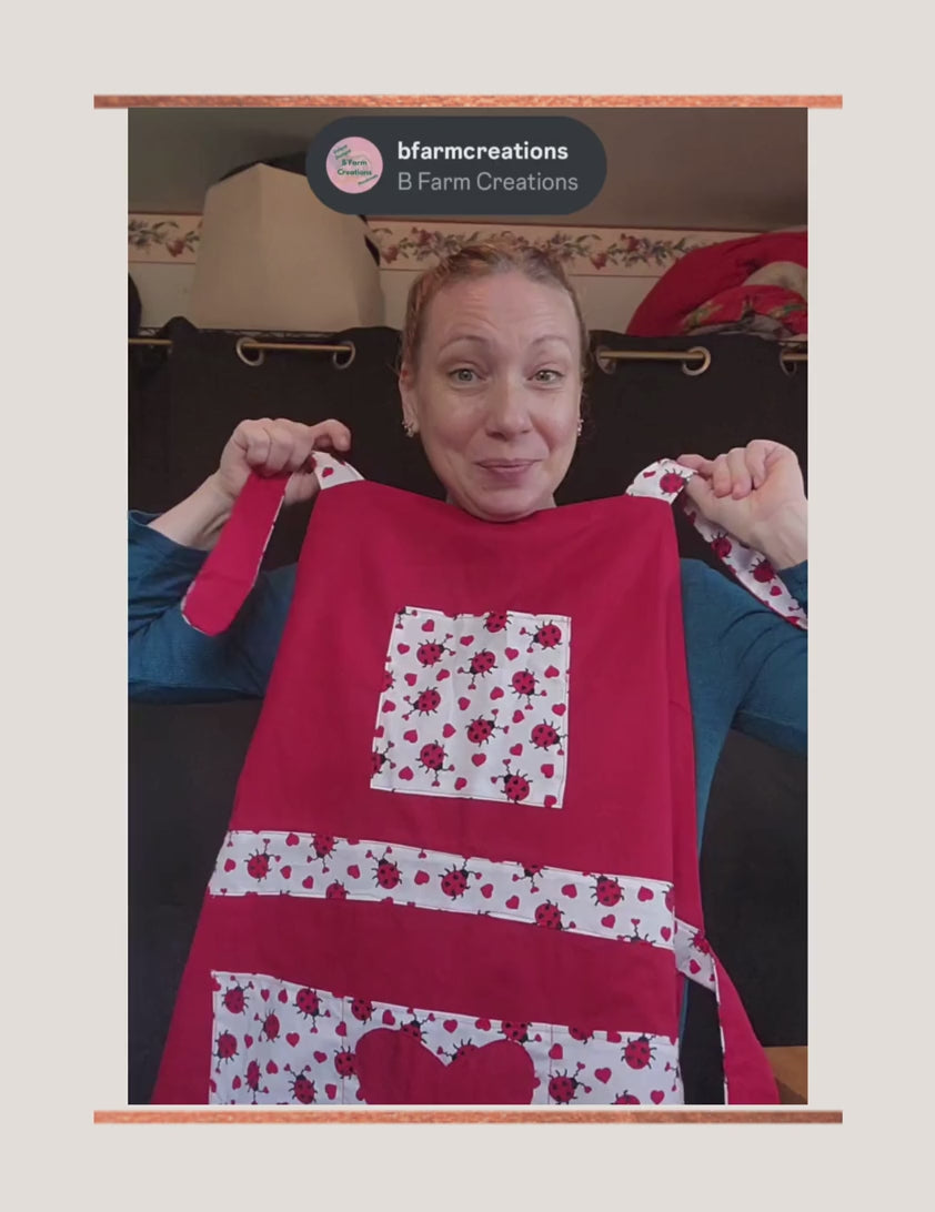 Celebrate love in the kitchen with our charming Love Bug adult apron! Handmade with care, this apron features a rich red base accented by an adorable ladybug-and-heart print that brings playful Valentine vibes to any bake day or dinner prep.